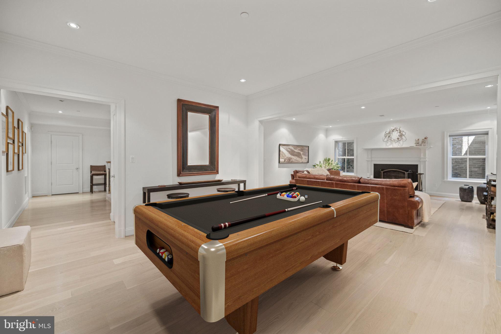 4410 Meadow Road Washington, DC 20007 - Photo 25 of 30 a living room with furniture a flat screen tv and a table