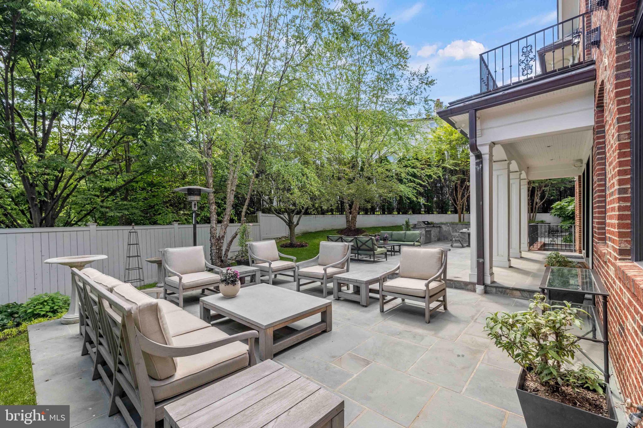 4410 Meadow Road Washington, DC 20007 - Photo 27 of 30 a view of a patio with table and chairs and potted plants