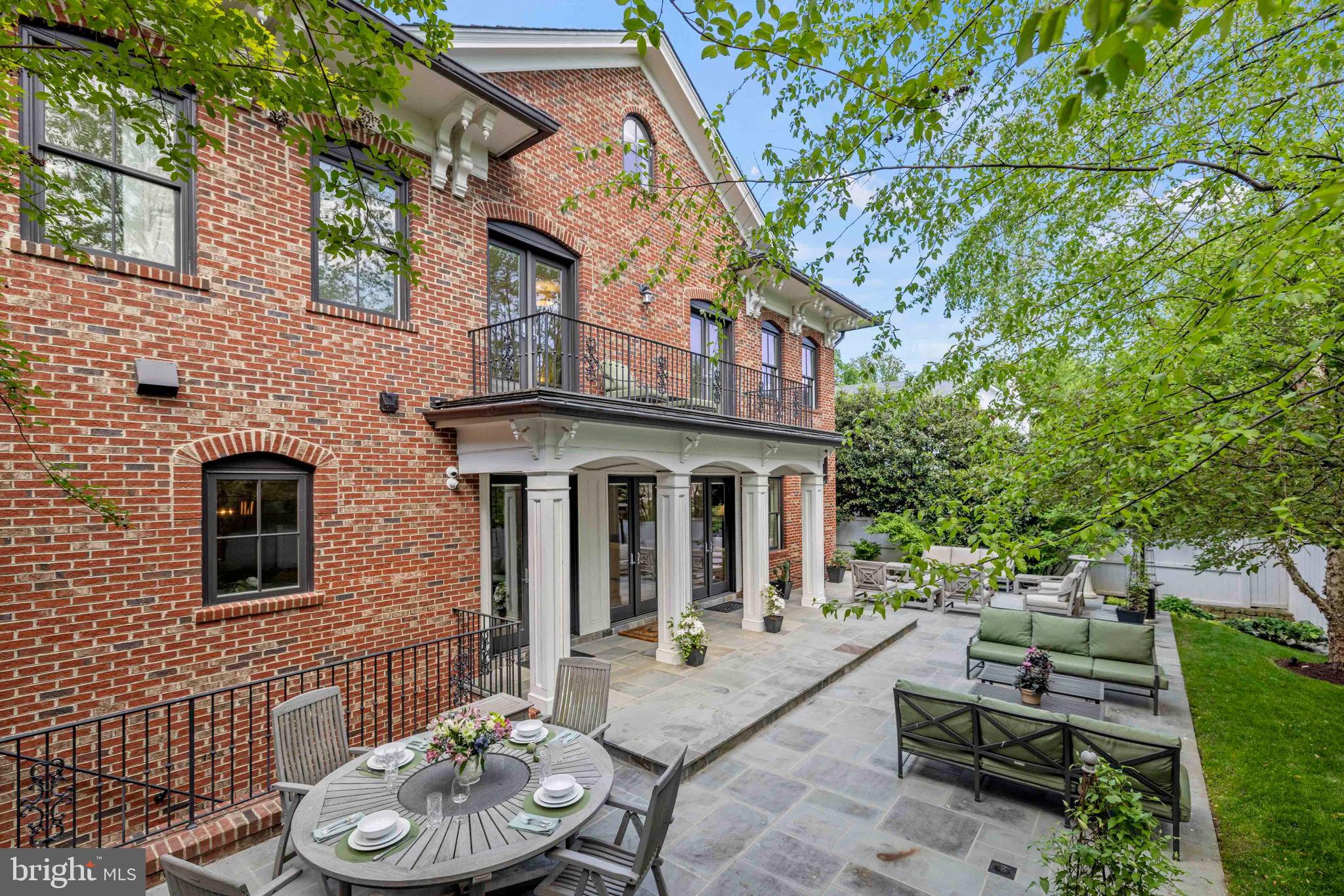 4410 Meadow Road Washington, DC 20007 - Photo 28 of 30 a view of a patio with couches table and chairs and potted plants