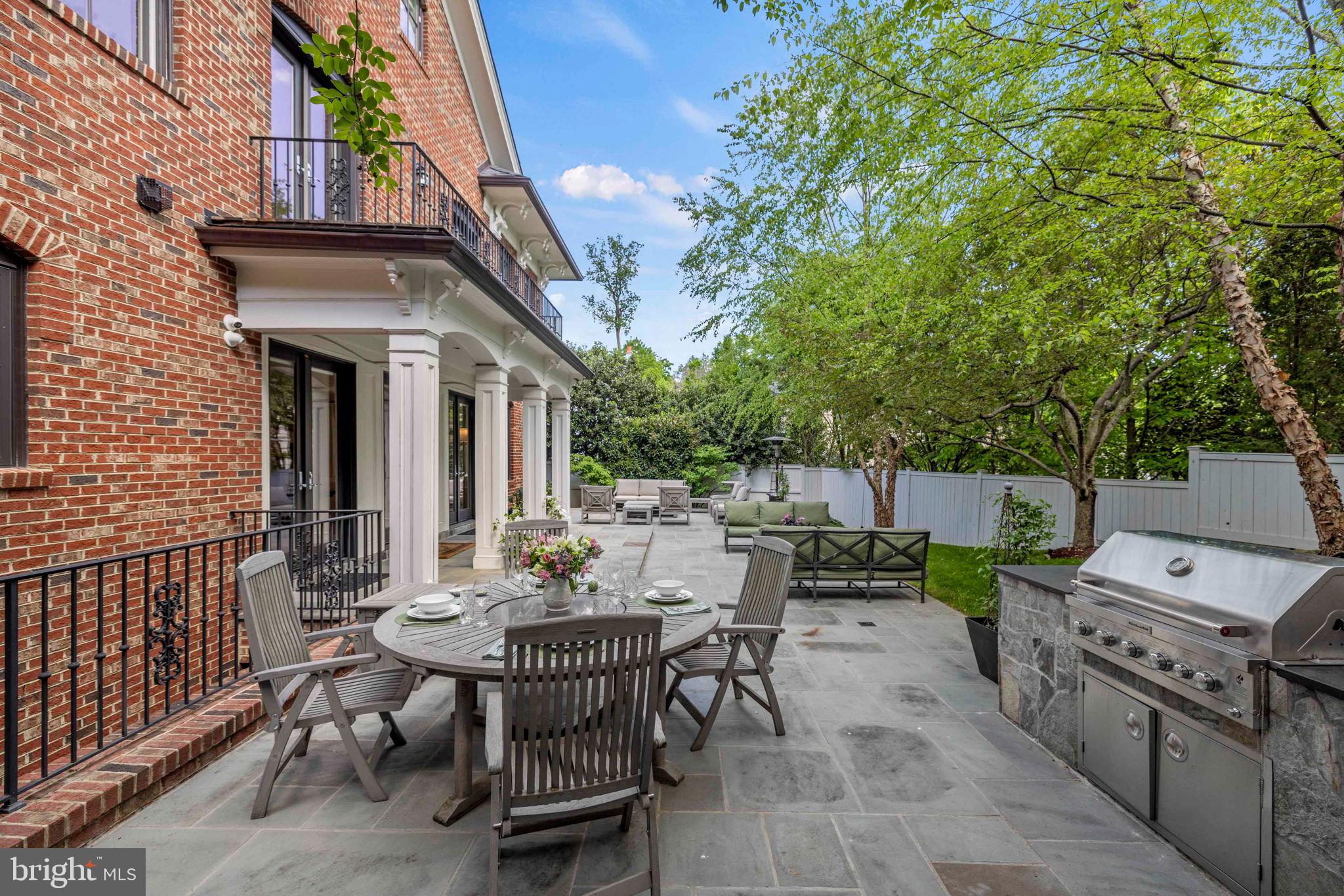 4410 Meadow Road Washington, DC 20007 - Photo 29 of 30 a view of a patio with table and chairs and potted plants