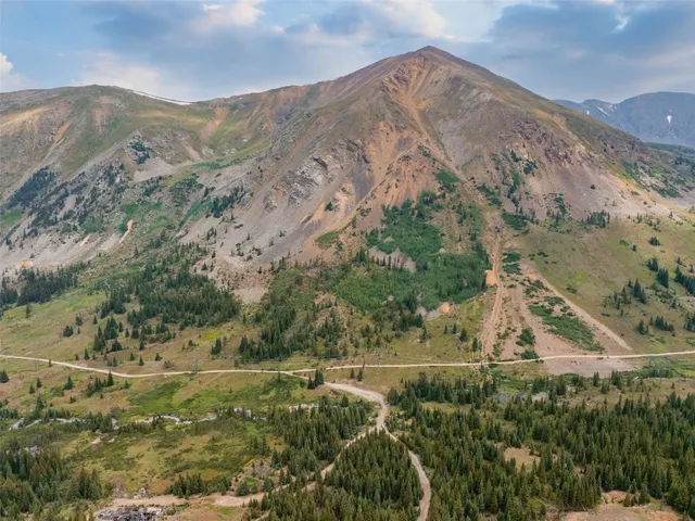a view of a yard with a mountain