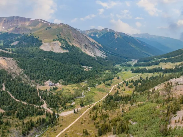 a view of a mountain with mountains in the background