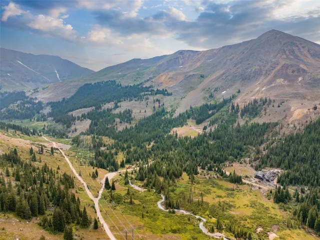 a view of a city with mountains in the background