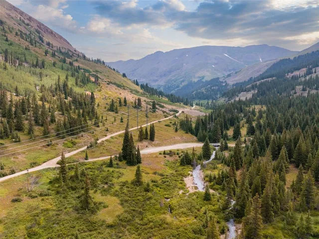 a view of a town with mountains in the background