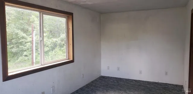 a view of a room that has a window
