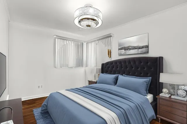 a bedroom with bed and a window