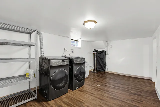 a view of storage and utility room with washer and dryer