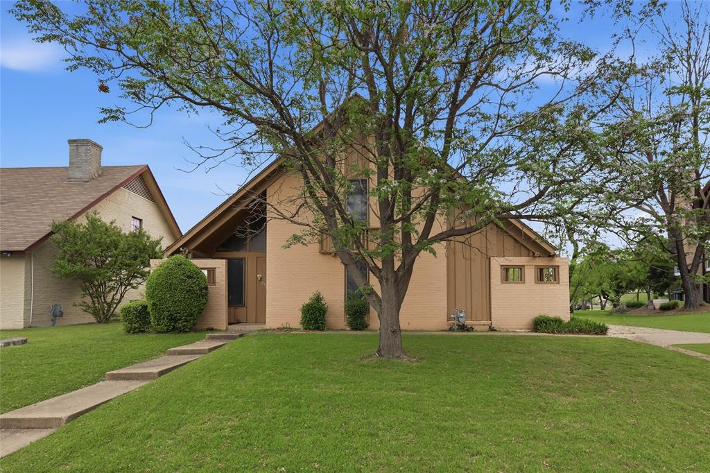 2814 Cheyenne Street Irving, TX 75062 - Photo 1 of 1 a front view of house with a garden