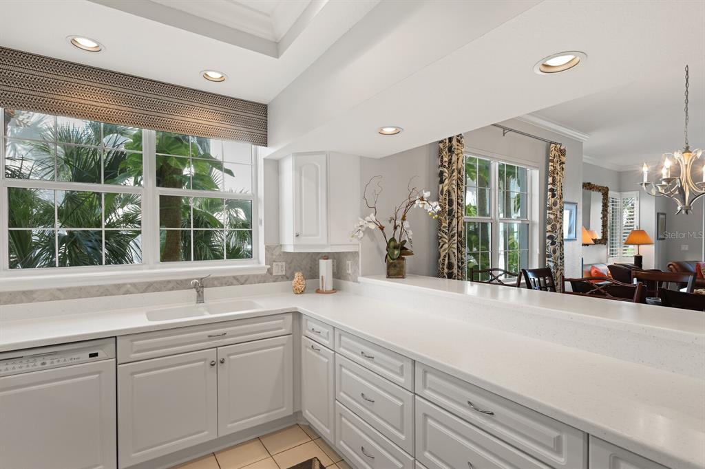 729 South Harbor Drive, Unit 1 Boca Grande, FL 33921 - Photo 14 of 68 a bathroom with a sink and a large mirror