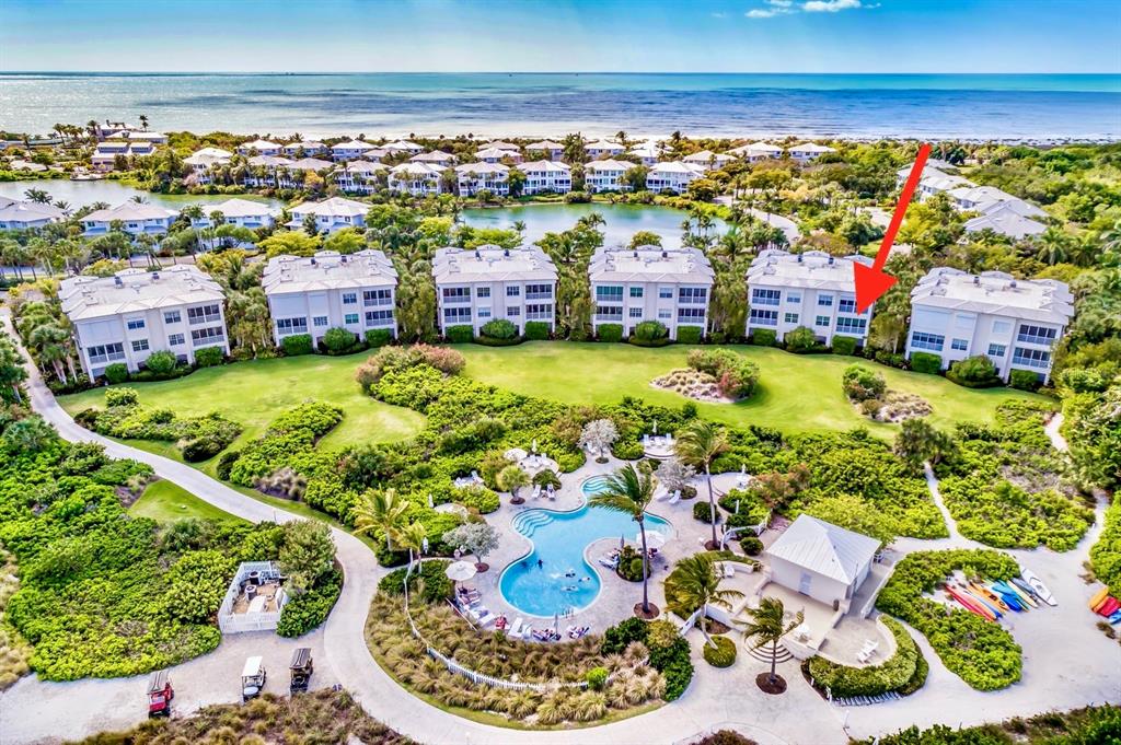 729 South Harbor Drive, Unit 1 Boca Grande, FL 33921 - Photo 22 of 68 a view of a swimming pool with an outdoor seating