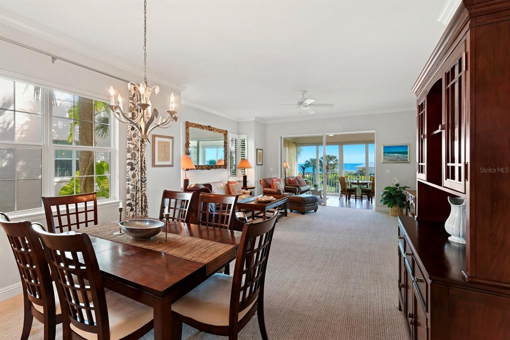 729 South Harbor Drive, Unit 1 Boca Grande, FL 33921 - Photo 4 of 68 a dining room with furniture a chandelier and window