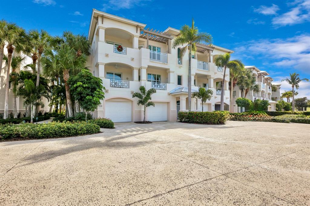 729 South Harbor Drive, Unit 1 Boca Grande, FL 33921 - Photo 4 of 68 front view of a building with a street