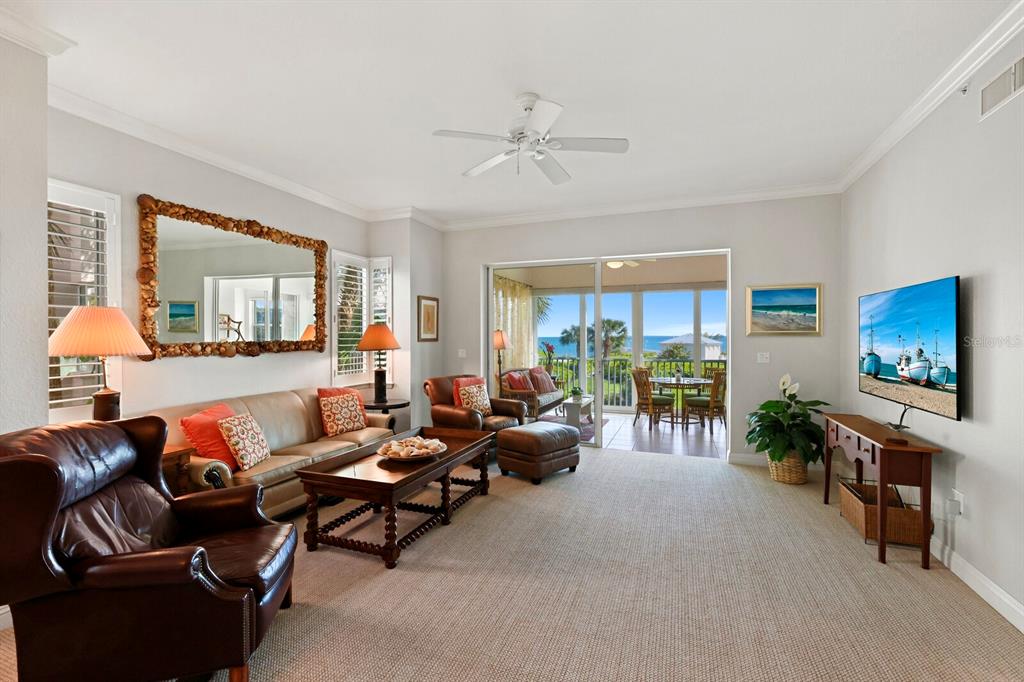 729 South Harbor Drive, Unit 1 Boca Grande, FL 33921 - Photo 5 of 68 a living room with furniture and a flat screen tv