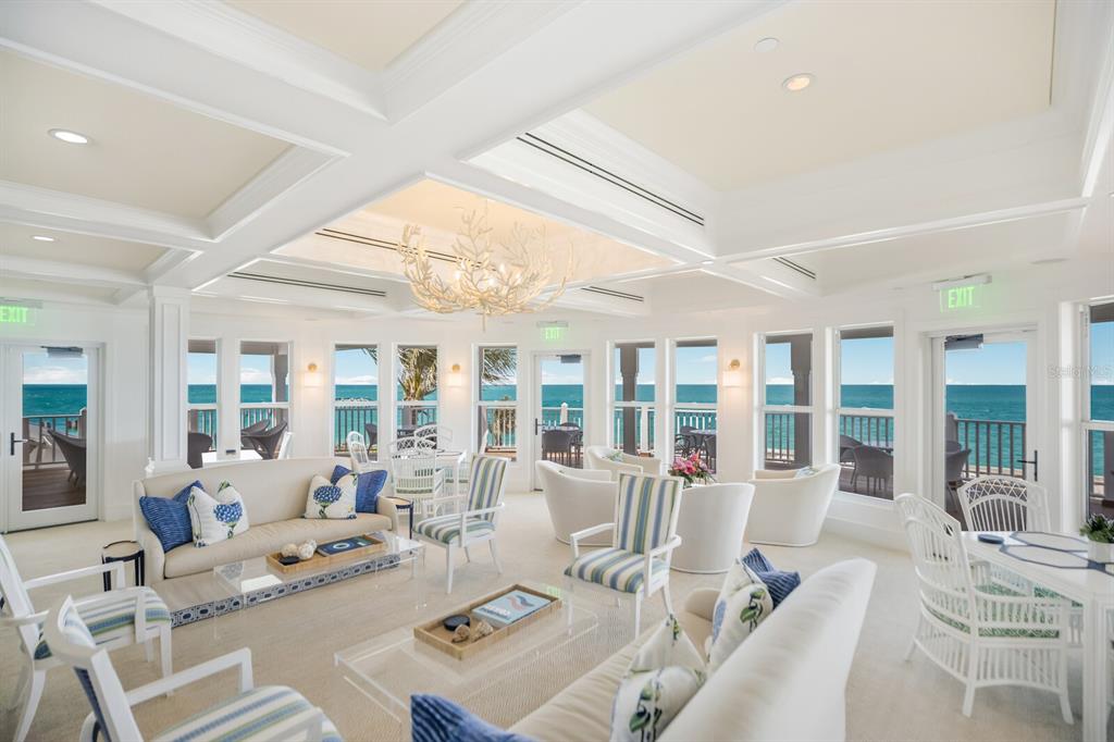 729 South Harbor Drive, Unit 1 Boca Grande, FL 33921 - Photo 56 of 68 a living room with furniture and floor to ceiling windows