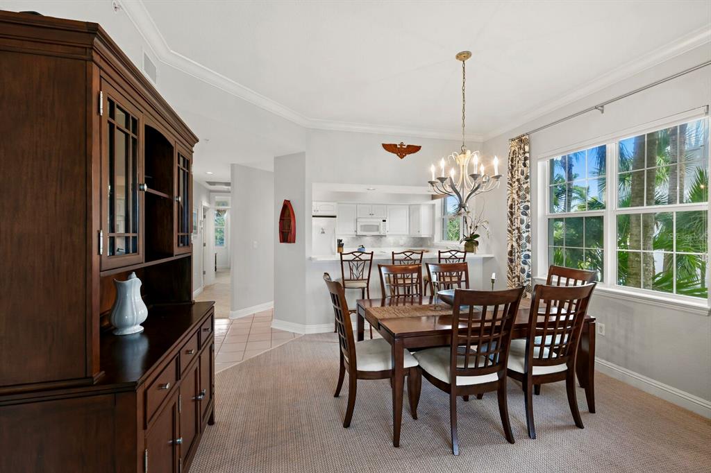 729 South Harbor Drive, Unit 1 Boca Grande, FL 33921 - Photo 10 of 68 a view of a dining room with furniture window and wooden floor