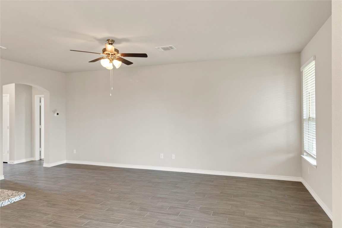 5809 Ariel Cove Belton, TX 76513 - Photo 5 of 15 a view of empty room with wooden floor and fan