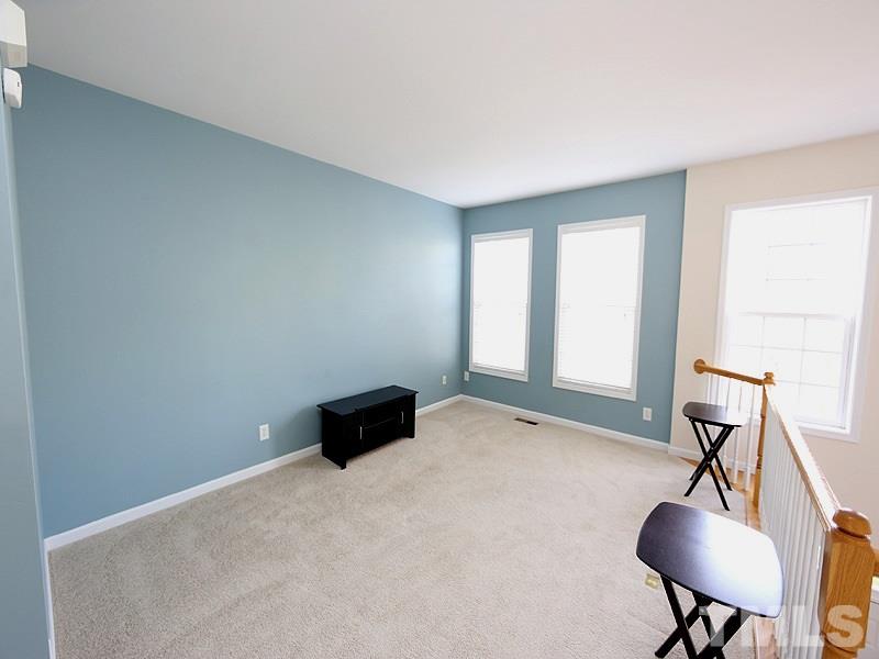 5317 Echo Ridge Road Raleigh, NC 27612 - Photo 2 of 17 a living room with furniture and a window