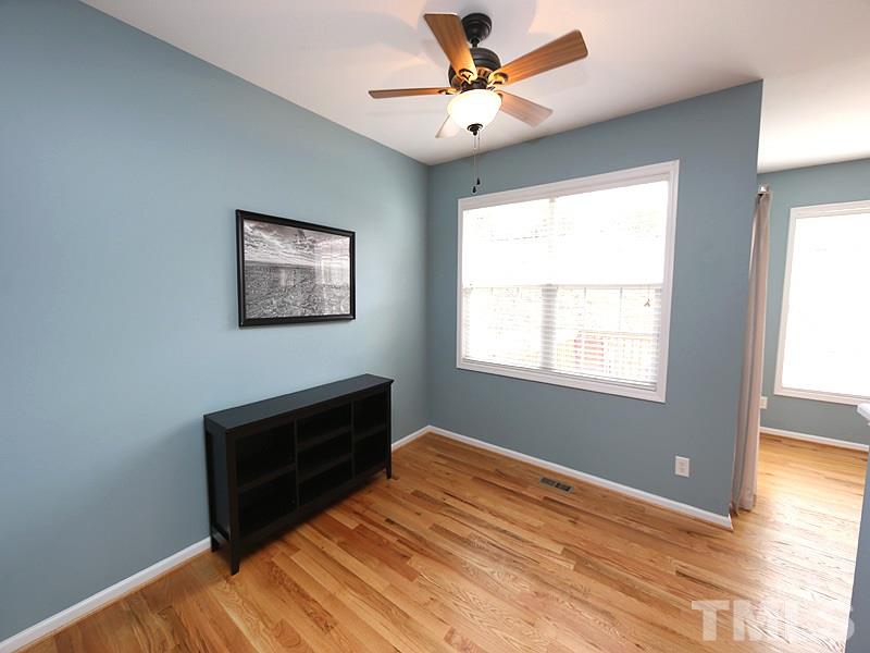 5317 Echo Ridge Road Raleigh, NC 27612 - Photo 4 of 17 a view of workspace with window and a ceiling fan