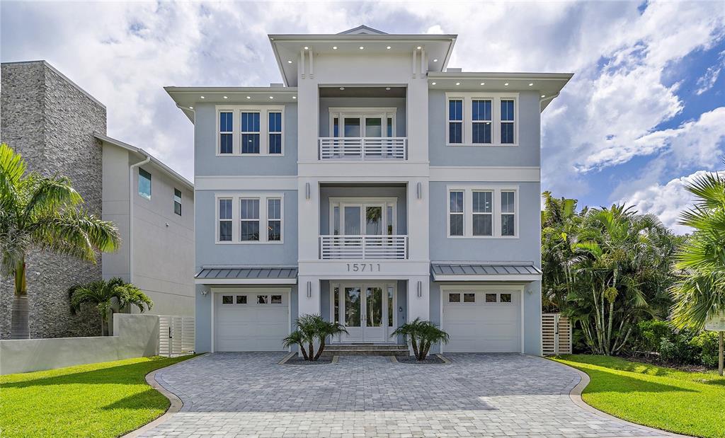 15711 Redington Drive Redington Beach, FL 33708 - Photo 1 of 1 a front view of a building with garden