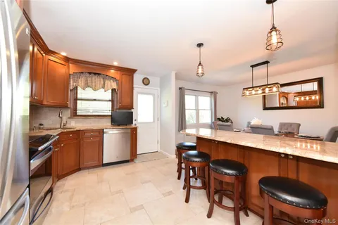 a large kitchen with a table and chairs in it