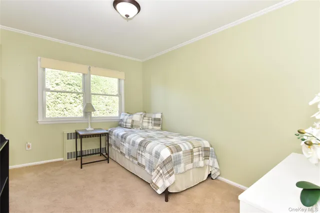 a bedroom with a bed and a table in it