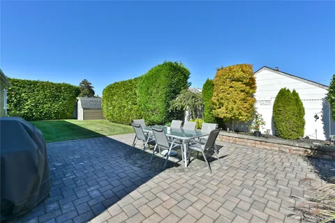 a view of a chairs and table in the patio