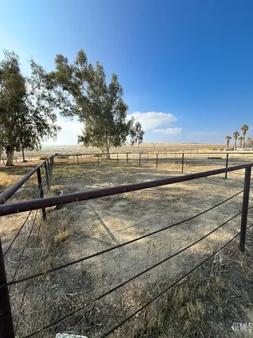 a view of a yard and ocean view