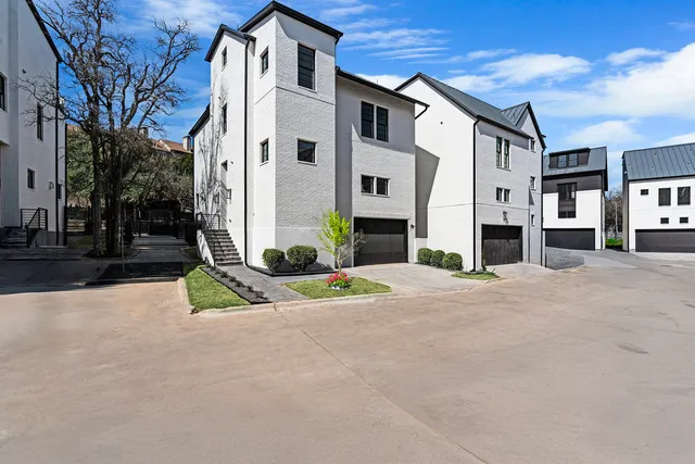 a front view of a building with a yard