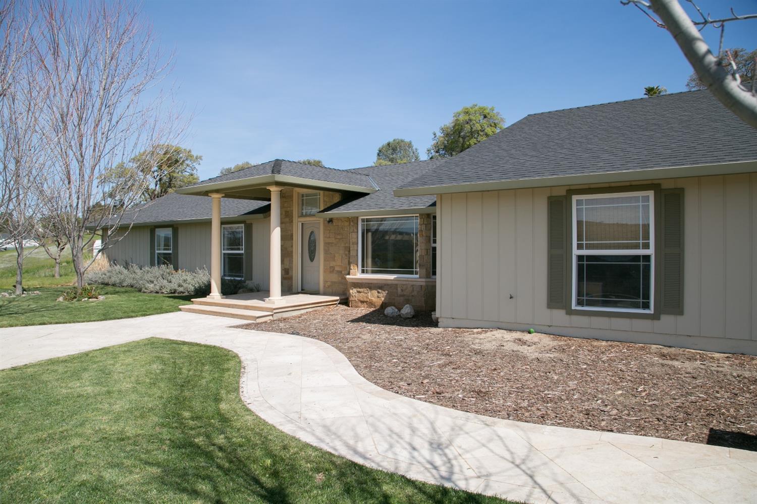 3711 Little John Road Copperopolis, CA 95228 - Photo 1 of 1 a front view of a house with garden and porch