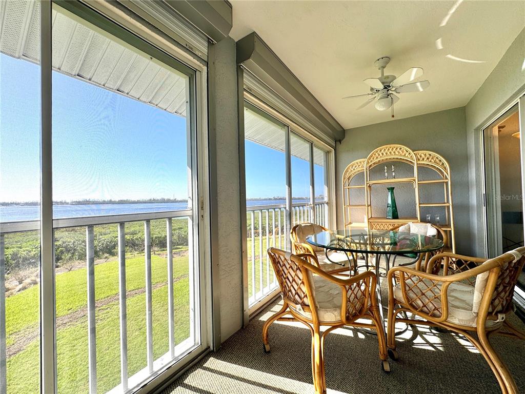1155 Edgewater Circle, Unit 28 Bradenton, FL 34209 - Photo 1 of 50 a view of a dining room with furniture window and outside view