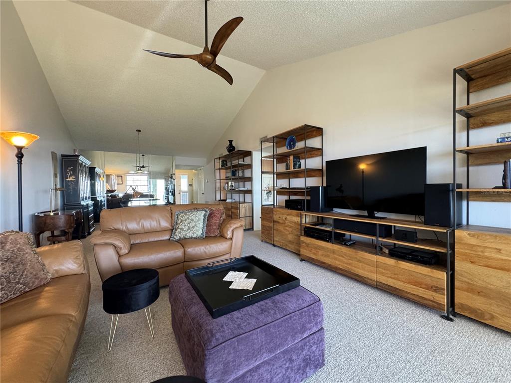 1155 Edgewater Circle, Unit 28 Bradenton, FL 34209 - Photo 15 of 50 a living room with furniture and a flat screen tv