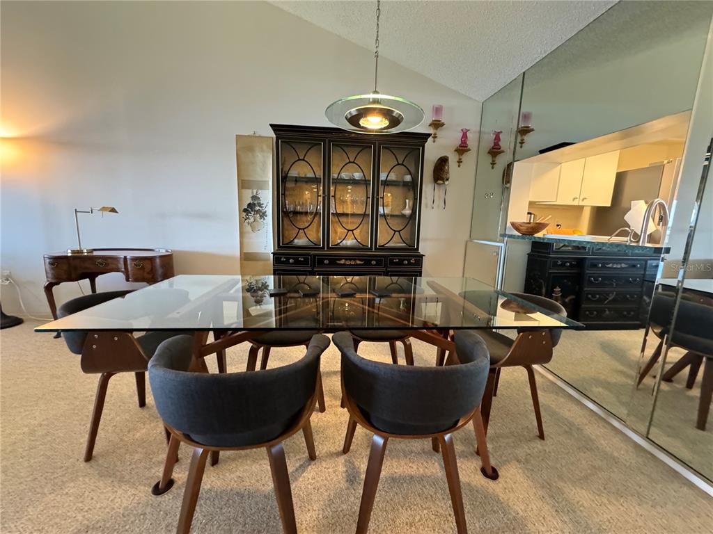 1155 Edgewater Circle, Unit 28 Bradenton, FL 34209 - Photo 22 of 50 a view of a table and chairs in a room