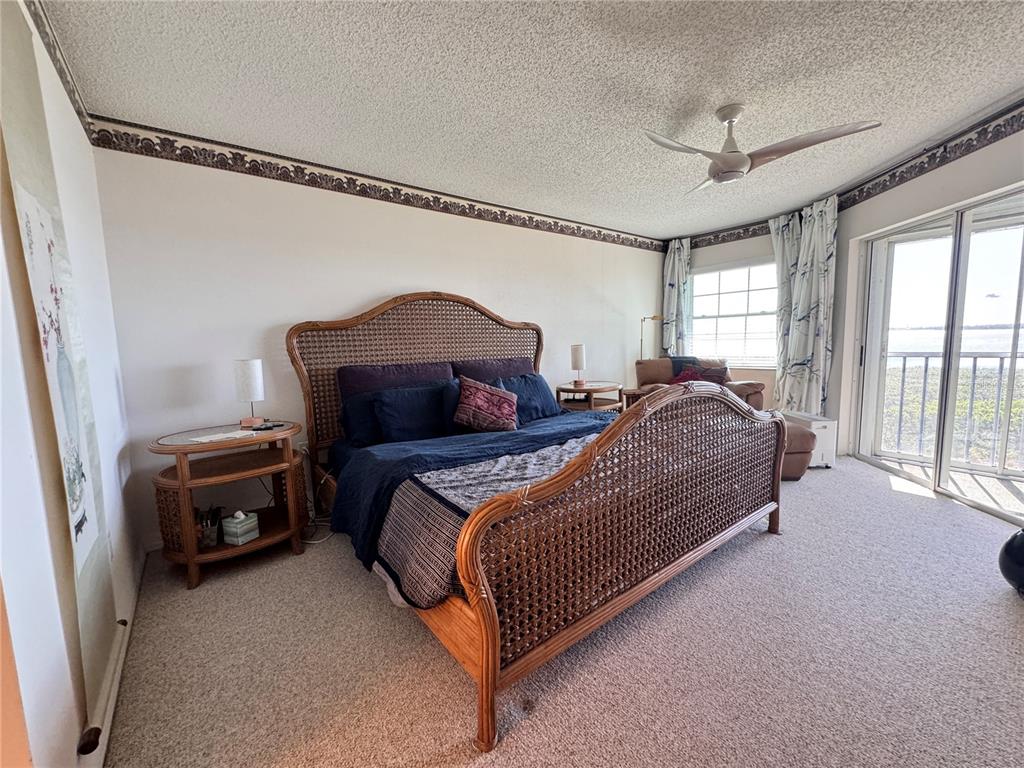 1155 Edgewater Circle, Unit 28 Bradenton, FL 34209 - Photo 23 of 50 a bedroom with a bed and a window