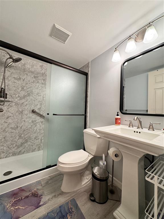 1155 Edgewater Circle, Unit 28 Bradenton, FL 34209 - Photo 31 of 50 a bathroom with a sink toilet and shower