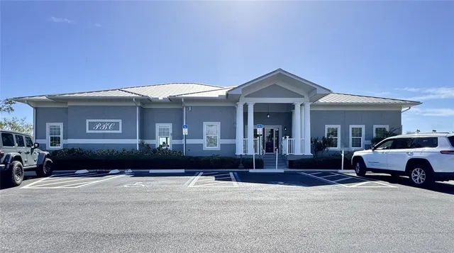 a view of swimming pool with outdoor seating and yard in back