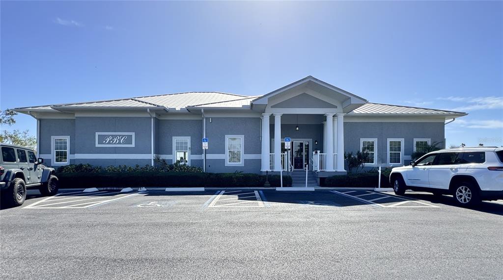 1155 Edgewater Circle, Unit 28 Bradenton, FL 34209 - Photo 32 of 50 a front view of a house with a yard