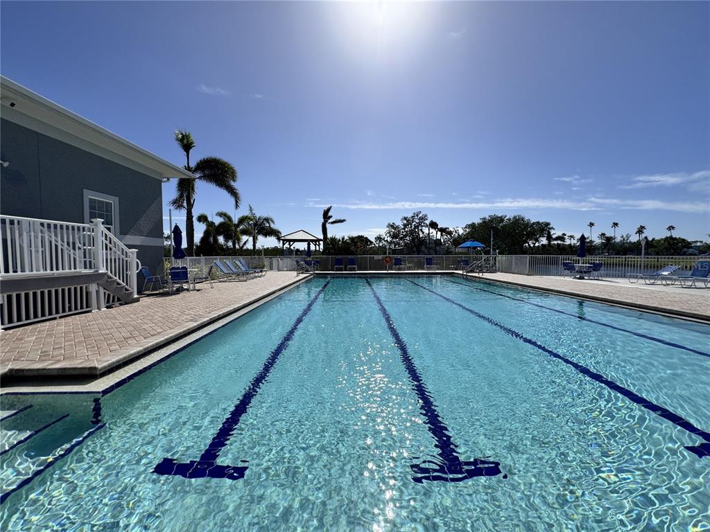 1155 Edgewater Circle, Unit 28 Bradenton, FL 34209 - Photo 33 of 50 a view of swimming pool with outdoor seating and yard in back