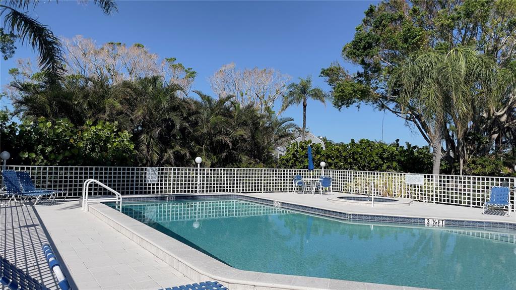 1155 Edgewater Circle, Unit 28 Bradenton, FL 34209 - Photo 35 of 50 a view of a roof deck with wooden fence and floor