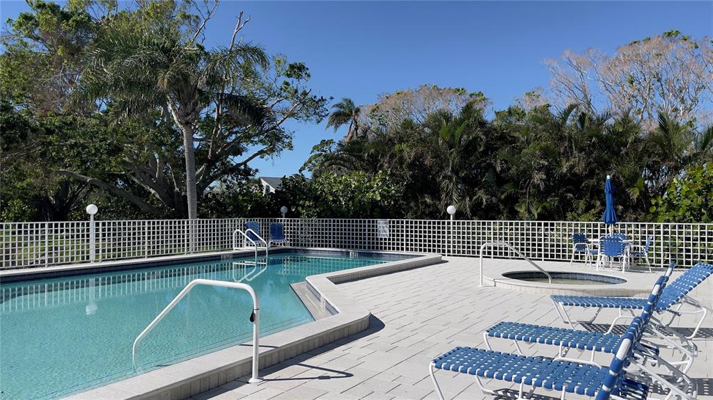 1155 Edgewater Circle, Unit 28 Bradenton, FL 34209 - Photo 36 of 50 a view of a chairs and table on the patio