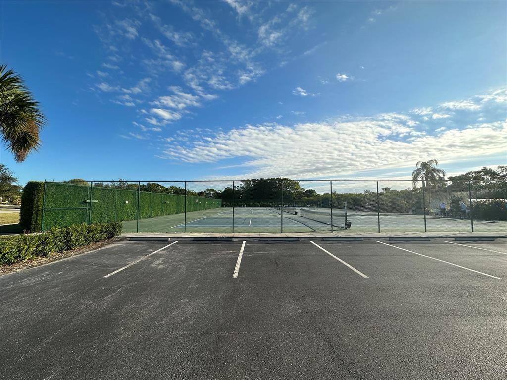 1155 Edgewater Circle, Unit 28 Bradenton, FL 34209 - Photo 44 of 50 a view of an outdoor space and tennis court