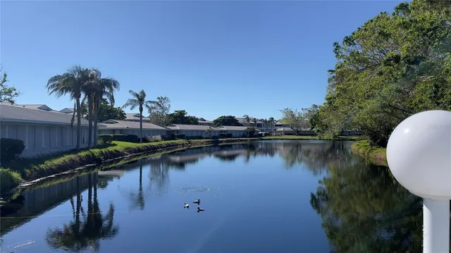 a house view with a lake view