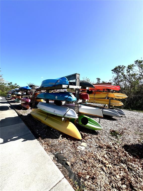 1155 Edgewater Circle, Unit 28 Bradenton, FL 34209 - Photo 50 of 50 a backyard of a house with fire pit and outdoor seating