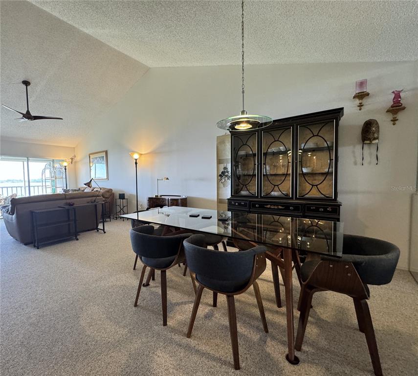1155 Edgewater Circle, Unit 28 Bradenton, FL 34209 - Photo 8 of 50 a living room with furniture and a wooden floor