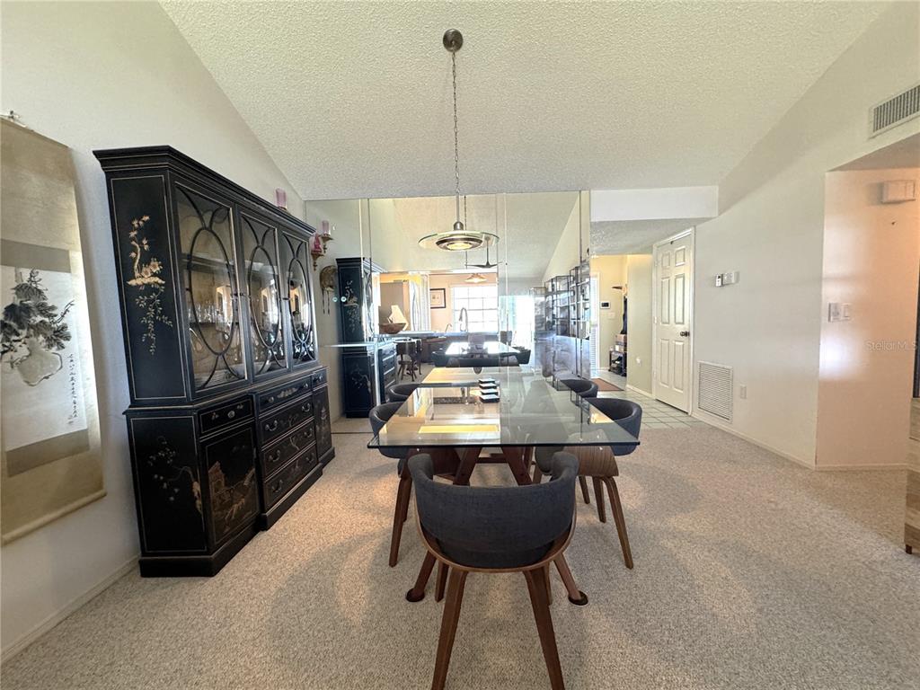 1155 Edgewater Circle, Unit 28 Bradenton, FL 34209 - Photo 9 of 50 a dining room with furniture and window