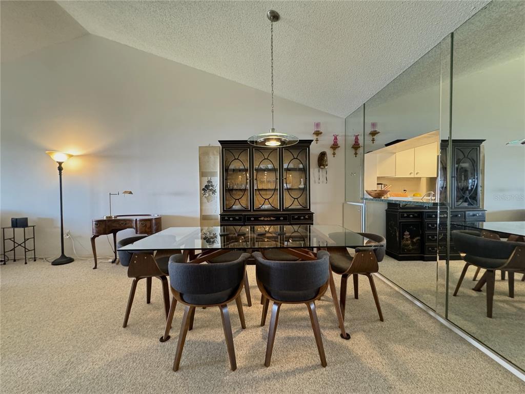 1155 Edgewater Circle, Unit 28 Bradenton, FL 34209 - Photo 10 of 50 a view of a dining room with furniture