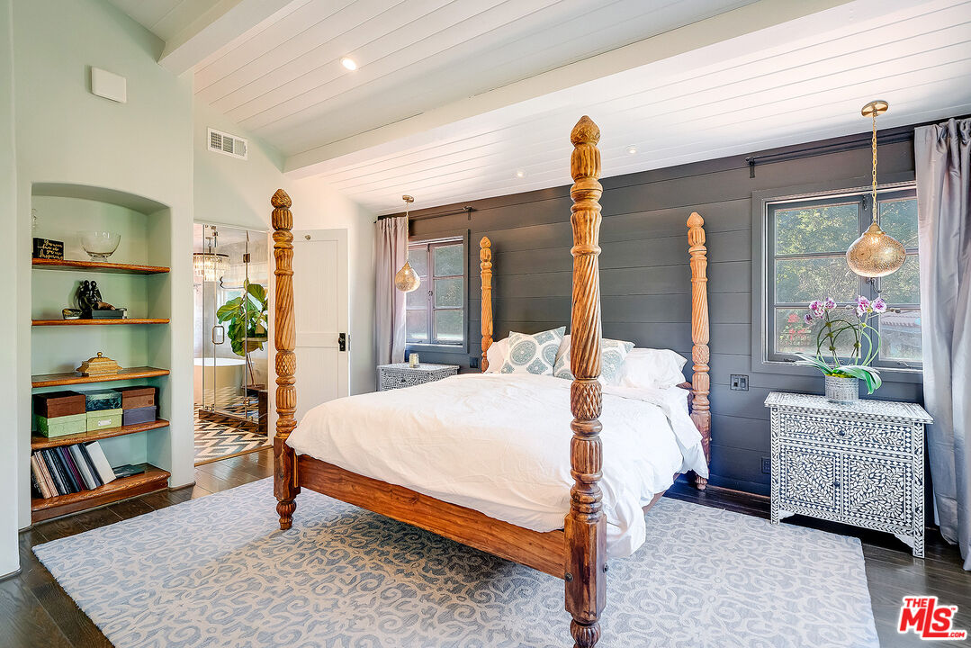 11670 Duque Drive Studio City, CA 91604 - Photo 16 of 48 a bedroom with a bed a dresser and book shelf