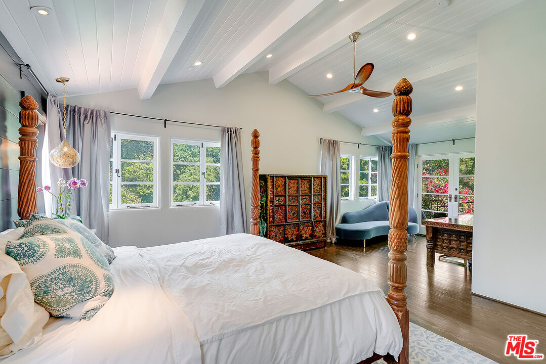 11670 Duque Drive Studio City, CA 91604 - Photo 17 of 48 a bedroom with a large bed and a large window