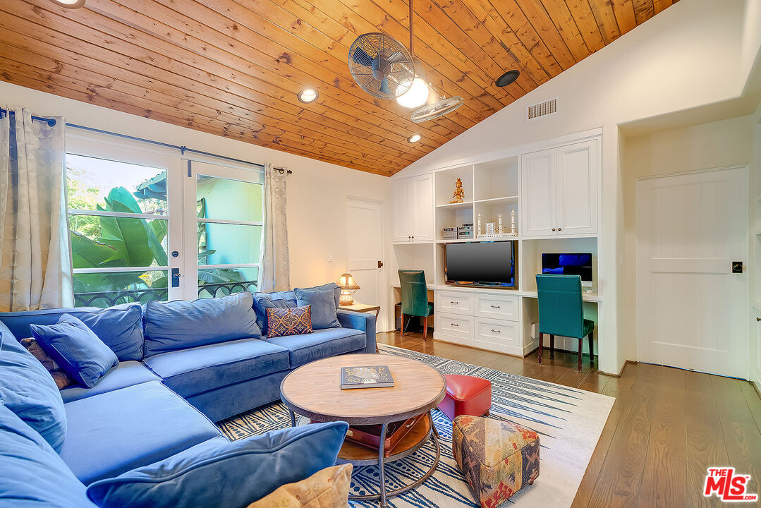 11670 Duque Drive Studio City, CA 91604 - Photo 24 of 48 a living room with furniture and a flat screen tv
