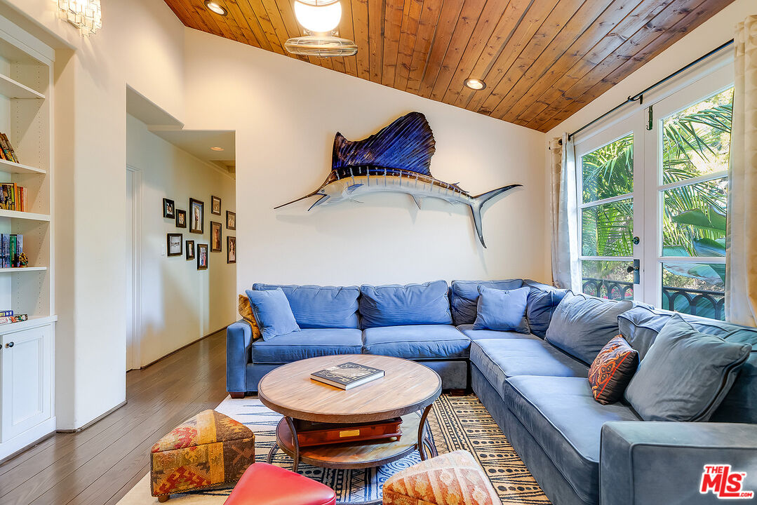 11670 Duque Drive Studio City, CA 91604 - Photo 25 of 48 a living room with furniture a rug and a window