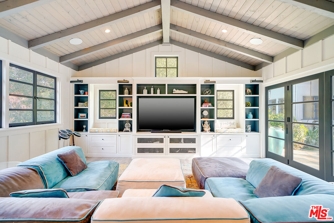 11670 Duque Drive Studio City, CA 91604 - Photo 33 of 48 a living room with furniture and a flat screen tv